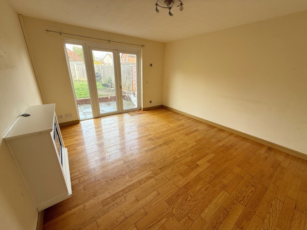Lot: 6 - END-TERRACE HOUSE FOR IMPROVEMENT - Reception room with French doors to rear garden
